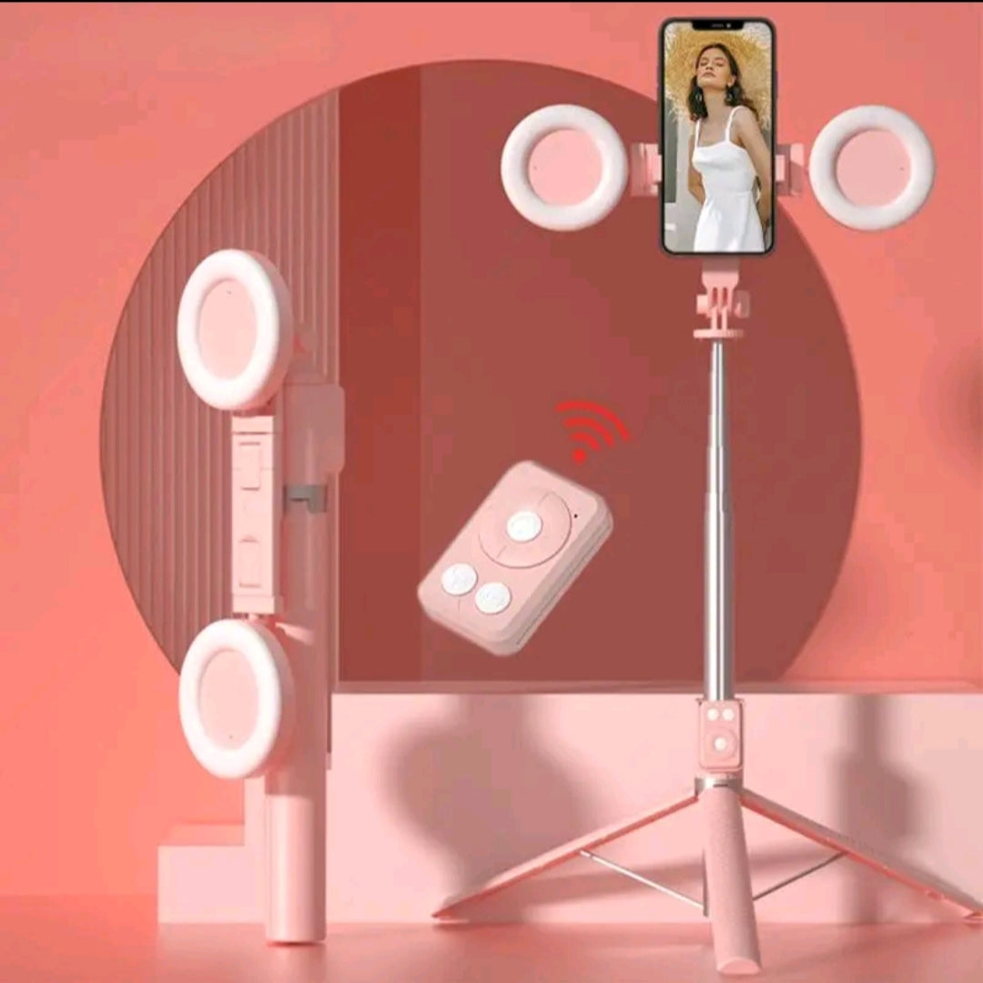 Trépied/Perche à selfie rose avec deux anneaux lumineux amovibles.